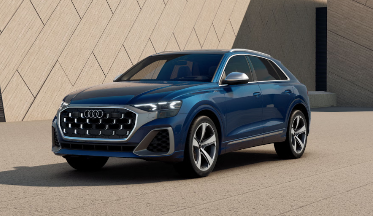 2026 Audi SQ8 parked near modern architectural wall in daylight